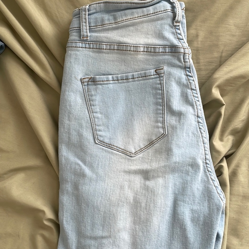 Light wash distressed skinny jeans